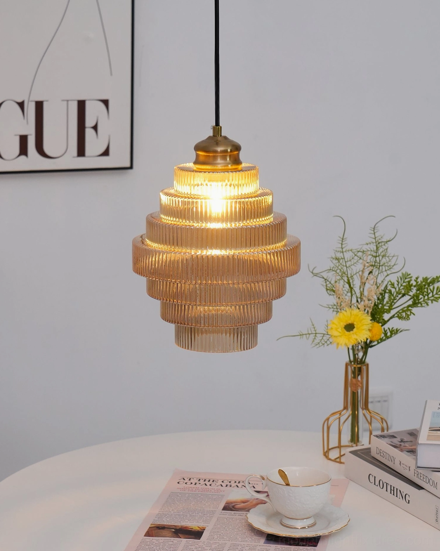 Ridged glass pendant light above cozy dining nook with warm amber glow and minimal decor
