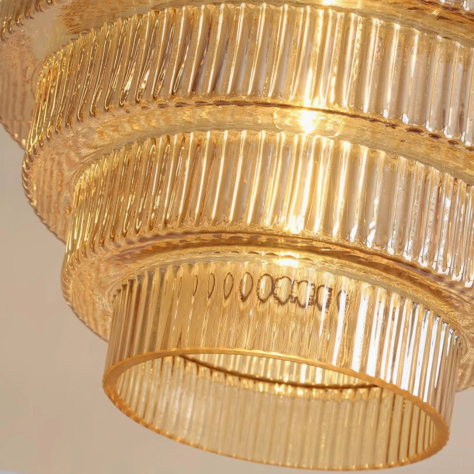 Ridged glass pendant light installation in gallery or showroom setting, architectural presentation