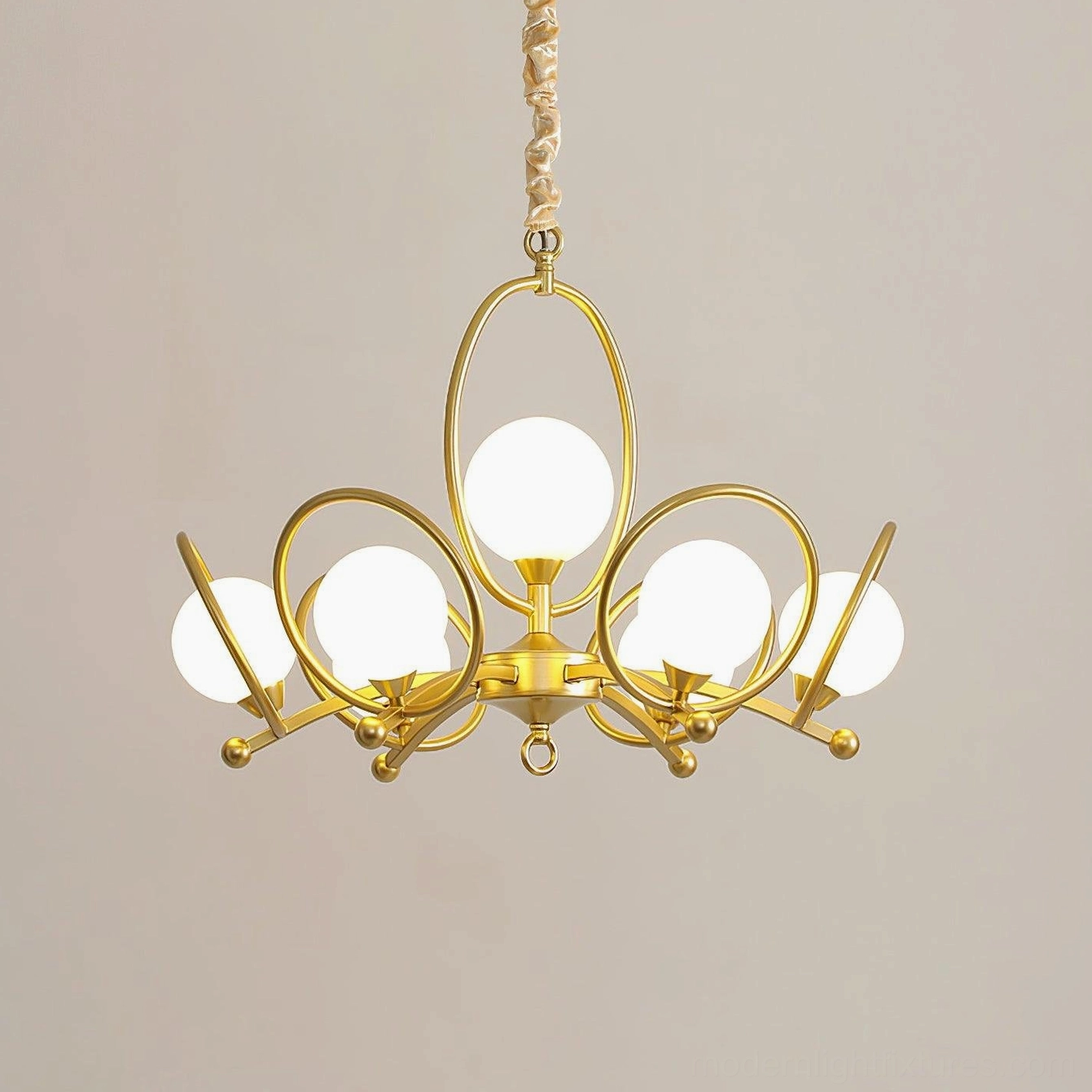 Riley 4-head chandelier installed in contemporary interior showing warm ambient light diffusion through frosted glass