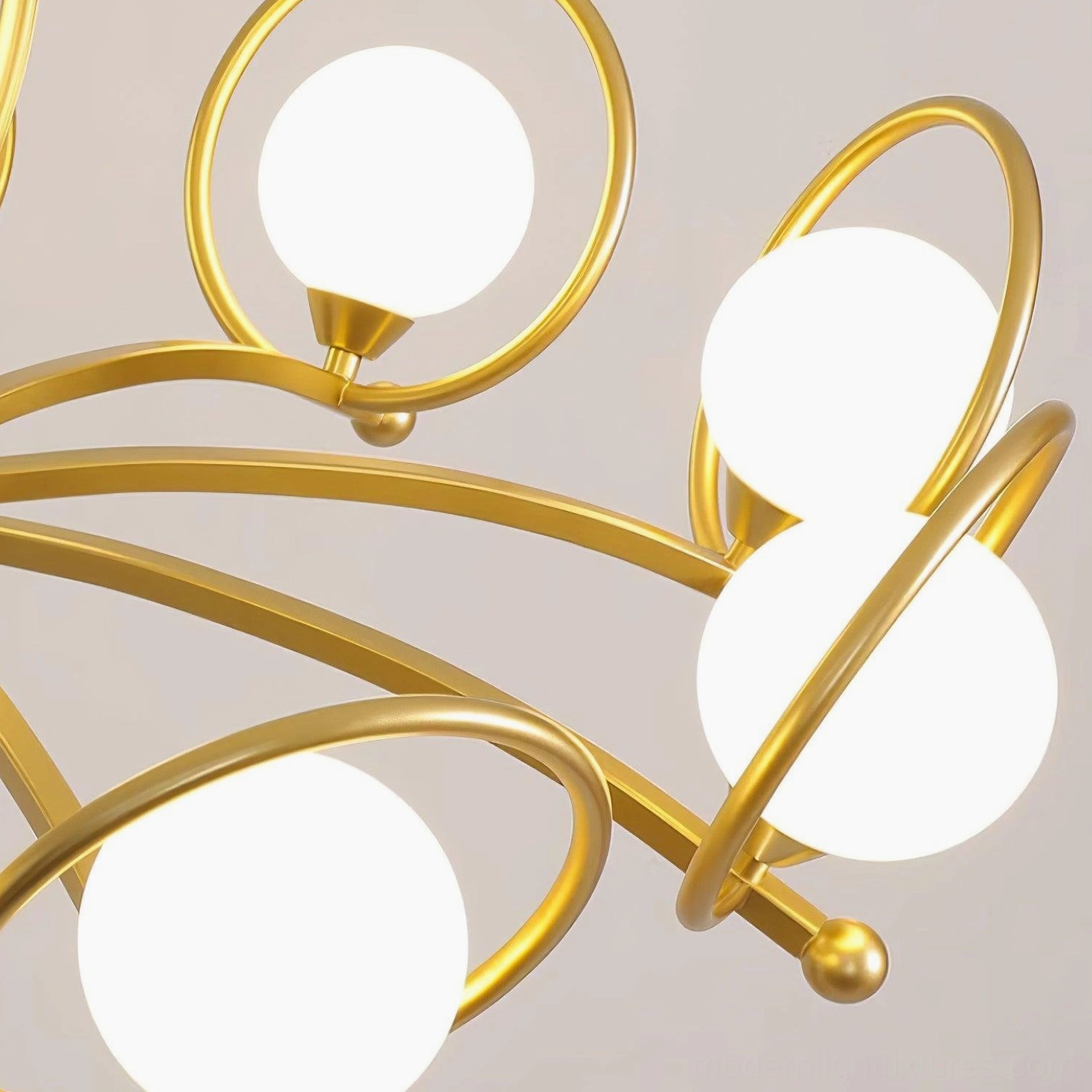 Riley chandelier arm assembly low-angle view with curved gold arms and spherical frosted glass shades