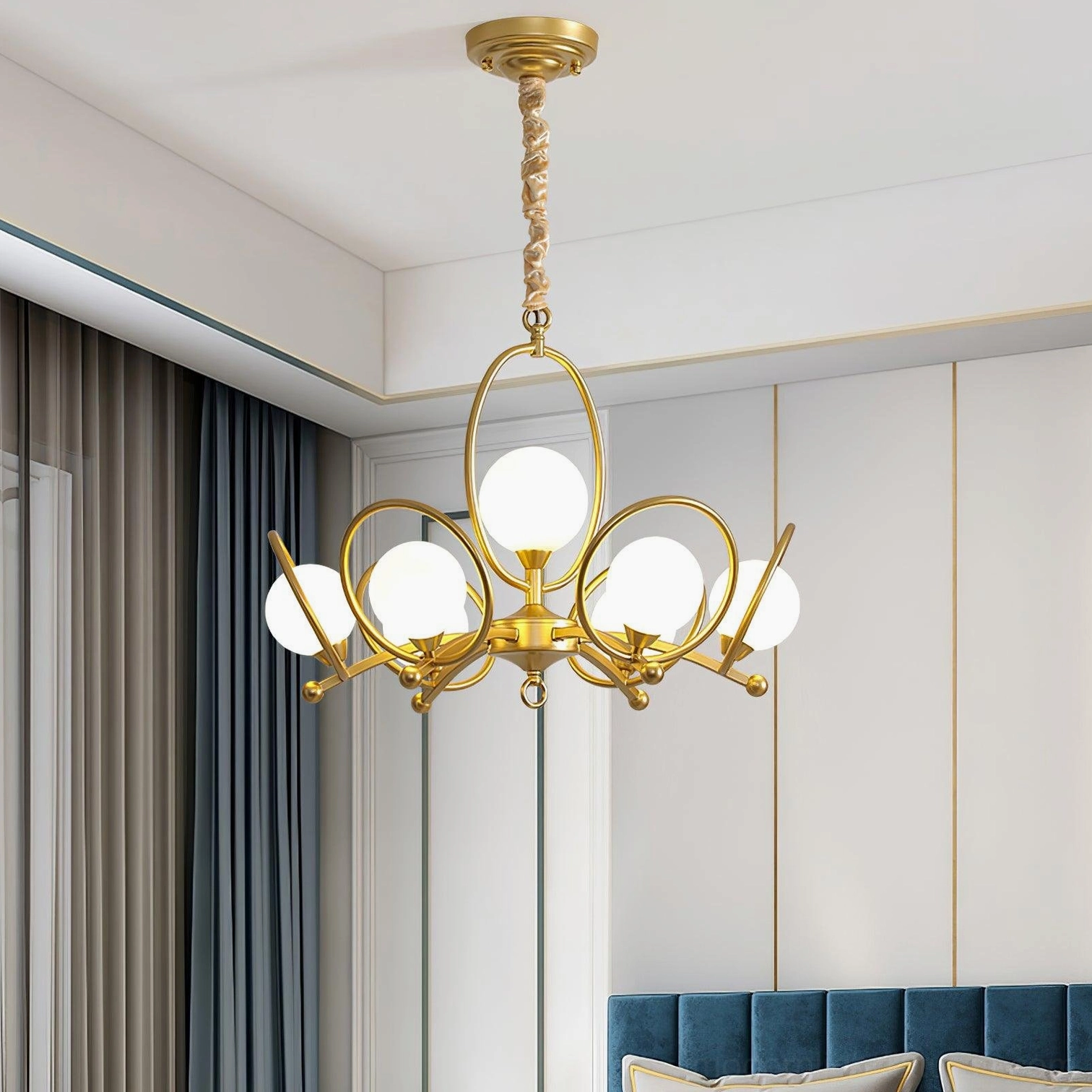 Riley modern multi-light chandelier installed in contemporary living room ceiling with curved brass arms and opal glass shades