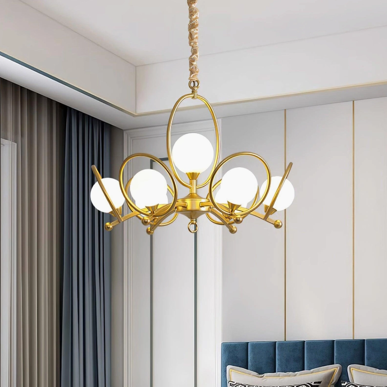 Riley luxury gold-finish chandelier in modern living room with paneled walls creating focal point ambiance