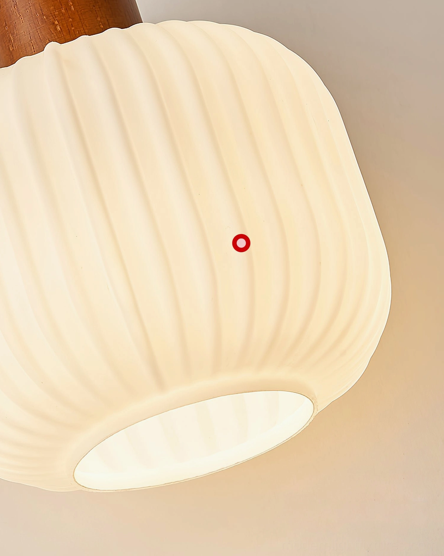 Frosted cream glass pendant shade with walnut wood cap detail, texture and material focus