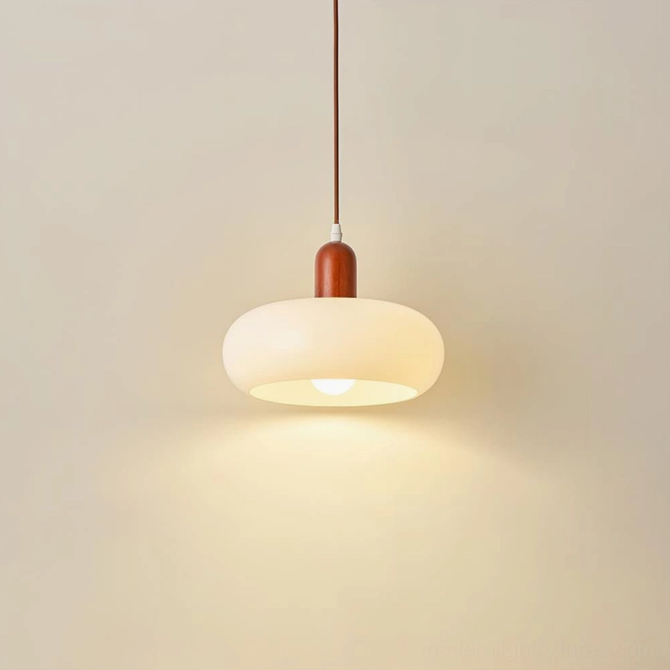 Modern pendant light with cream frosted glass shade and wooden top cap, direct front shot with warm ambient lighting