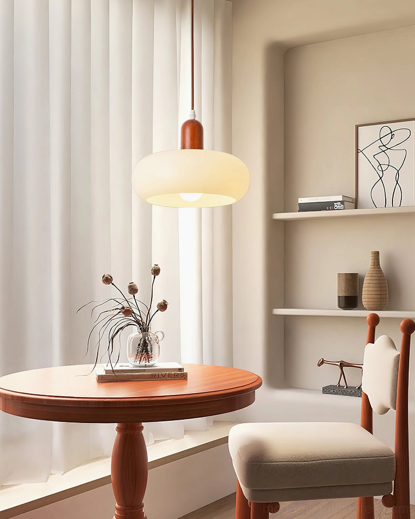 Nordic-style pendant lamp installed over dining nook with wooden table, eye-level interior shot