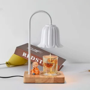 Rina white petal bell candle warmer lamp three-quarter view with scented candle on wooden base