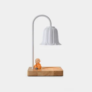 Rina white petal bell candle warmer lamp front view with wooden base and minimalist desk styling