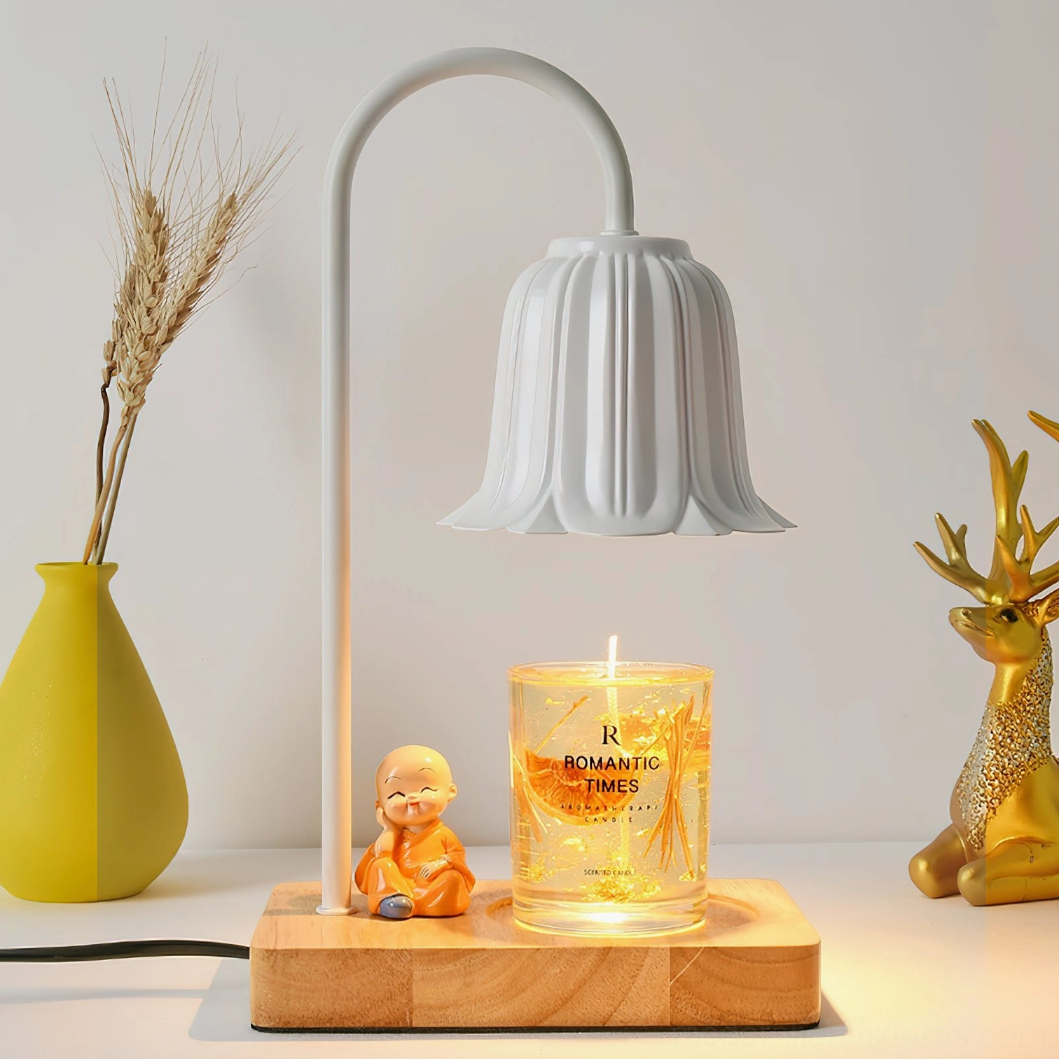 Rina white petal bell candle warmer lamp three-quarter perspective with dried floral decor