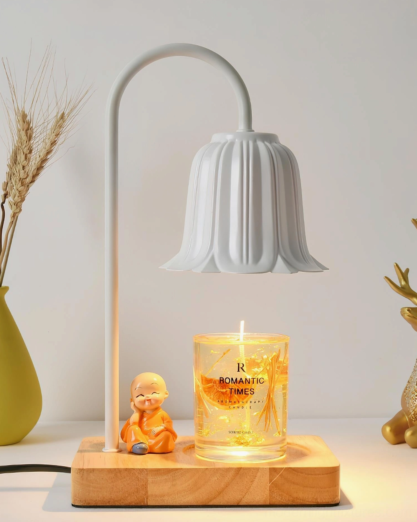 Rina white petal bell candle warmer lamp three-quarter angle with dried wheat decor styling