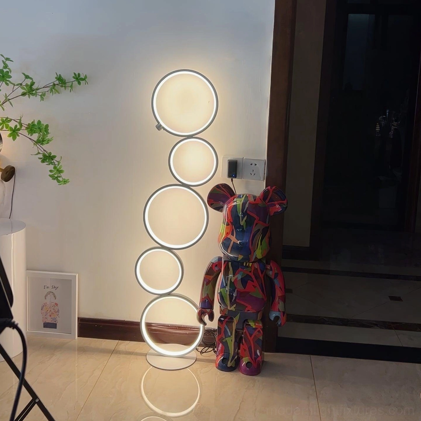 Contemporary minimalist ring floor lamp detail showing integrated LED light technology and construction