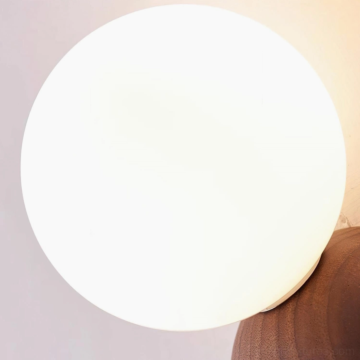 Ringo wall sconce in neutral interior showing balanced proportions and sculptural form as lighting accent piece