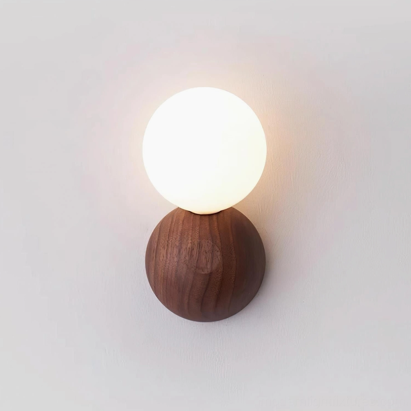 Ringo hardwired wall sconce mounted on white wall, full fixture view showing contemporary Japandi design aesthetic