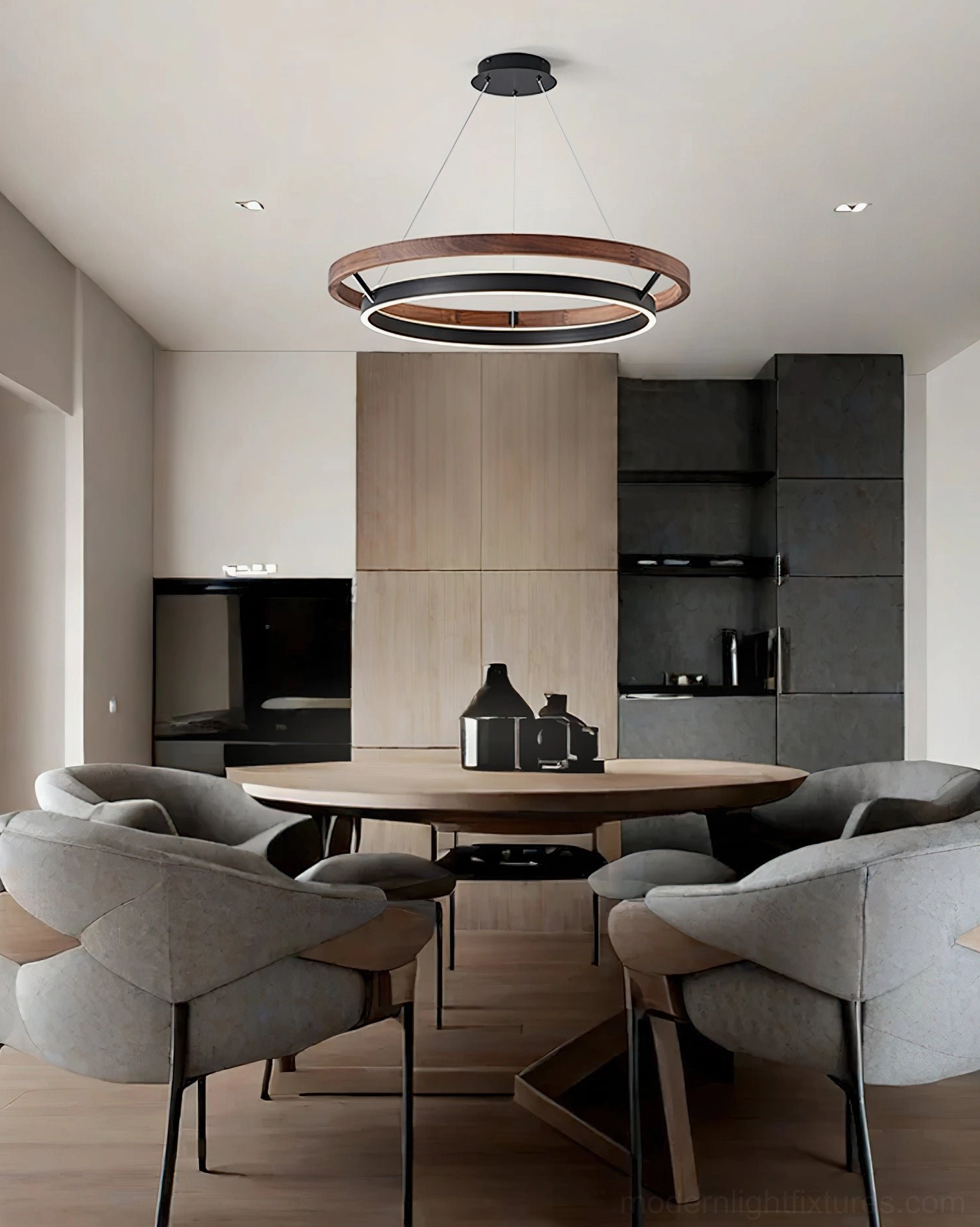 Ringora pendant light installed in contemporary dining room above round table