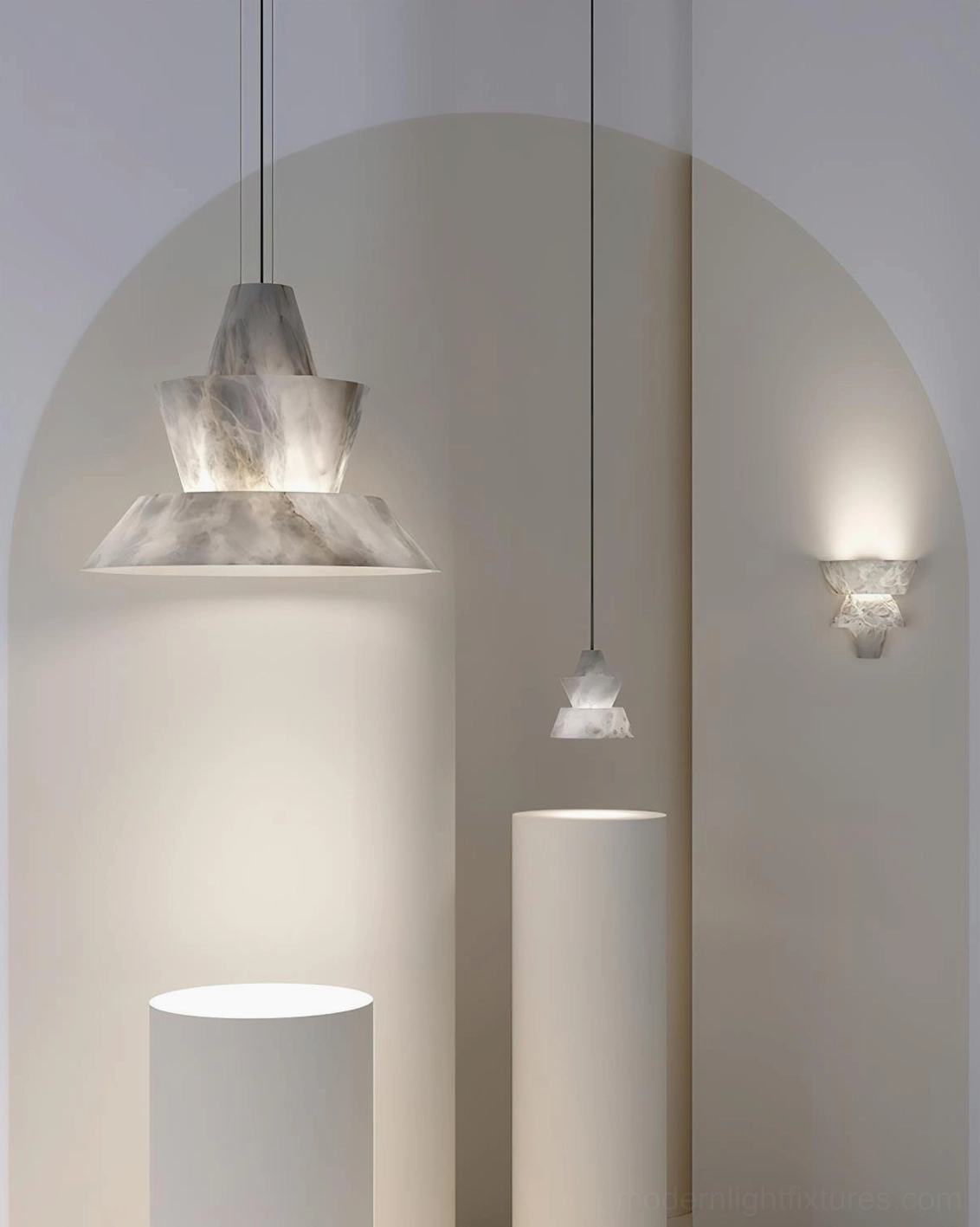 Rinkle alabaster pendant lamps paired with matching wall sconces in modern arched hallway, multiple tiered pendants with minimalist architectural decor