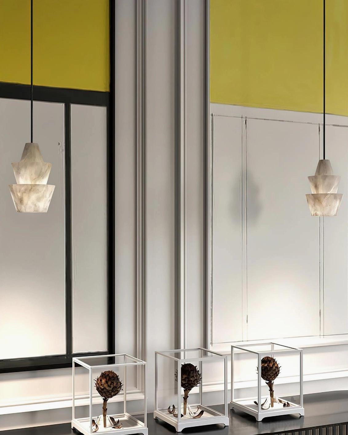 Pair of rinkle tiered alabaster pendant lights hanging in modern entryway above console table, yellow-black wall trim contemporary dining space