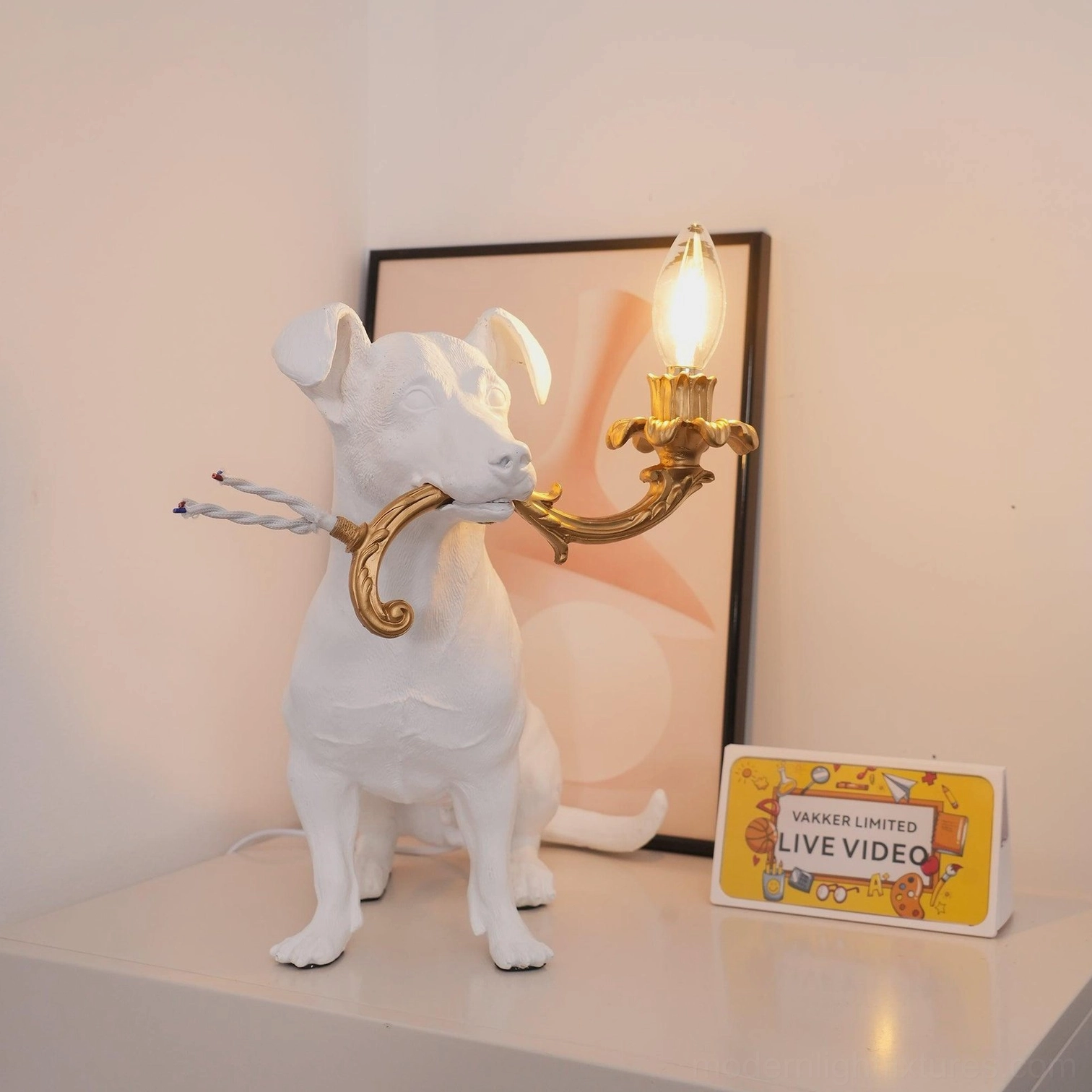 Rio dog table lamp front facing view, modern decorative dog light fixture, white resin matte finish gold details