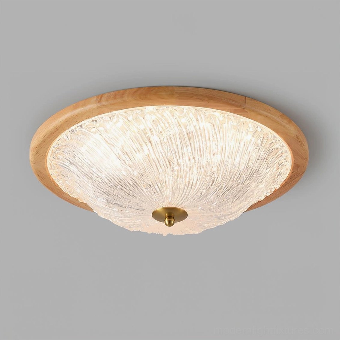 Contemporary ripple ceiling light fixture showing integrated LED and brass hardware accent - close-up detail