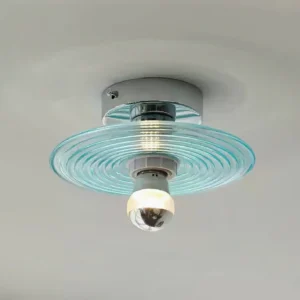 Overhead installation view of modern rippled glass flush mount ceiling light with polished chrome hardware