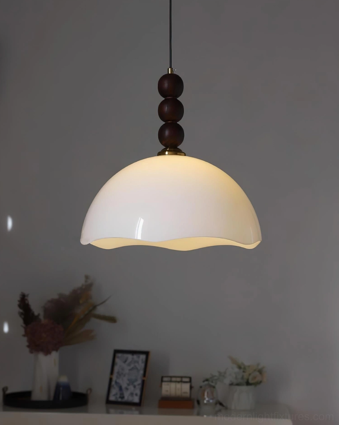 Vintage-inspired rippled pendant light hanging in Scandinavian minimalist interior with natural light and soft shadows