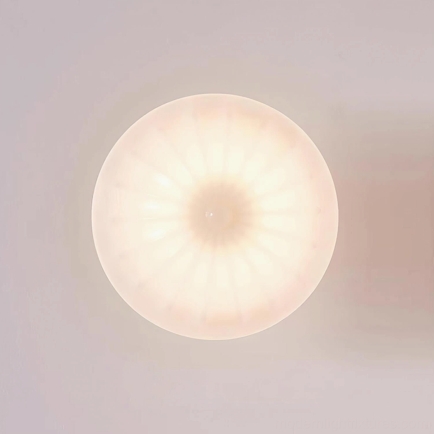 Ritten ceiling light fixture illuminated showing warm ambient light diffusion through ribbed glass