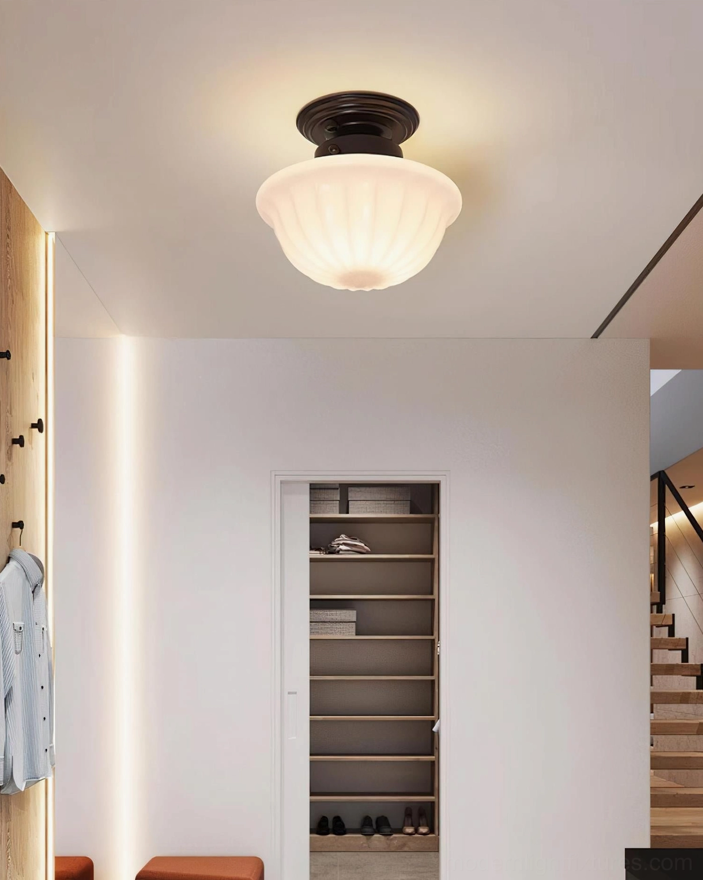 Ritten ceiling light fixture installed in closet hallway with shoe storage and neutral décor