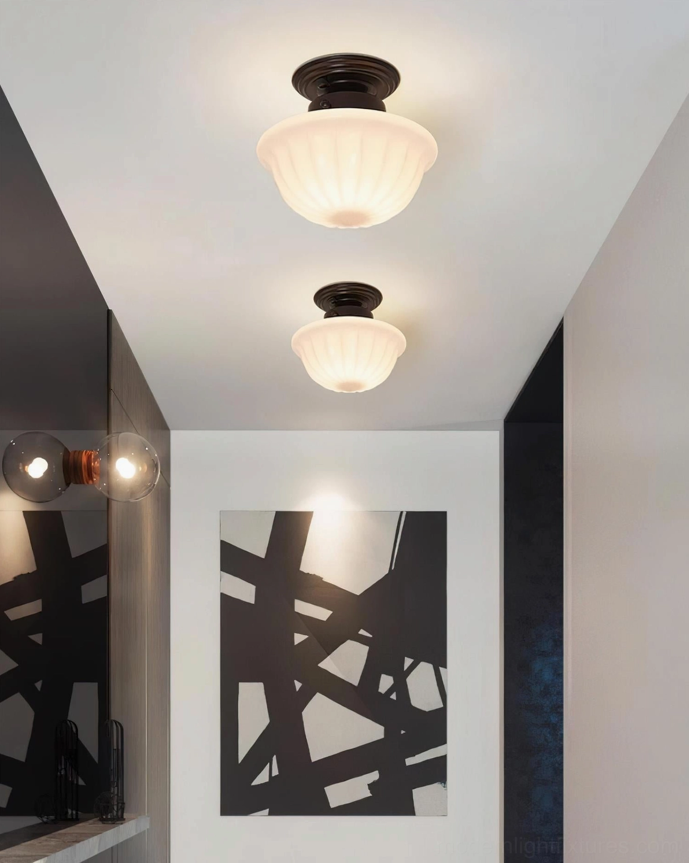 Modern entryway with matching pair of Ritten ceiling lights and contemporary wall art