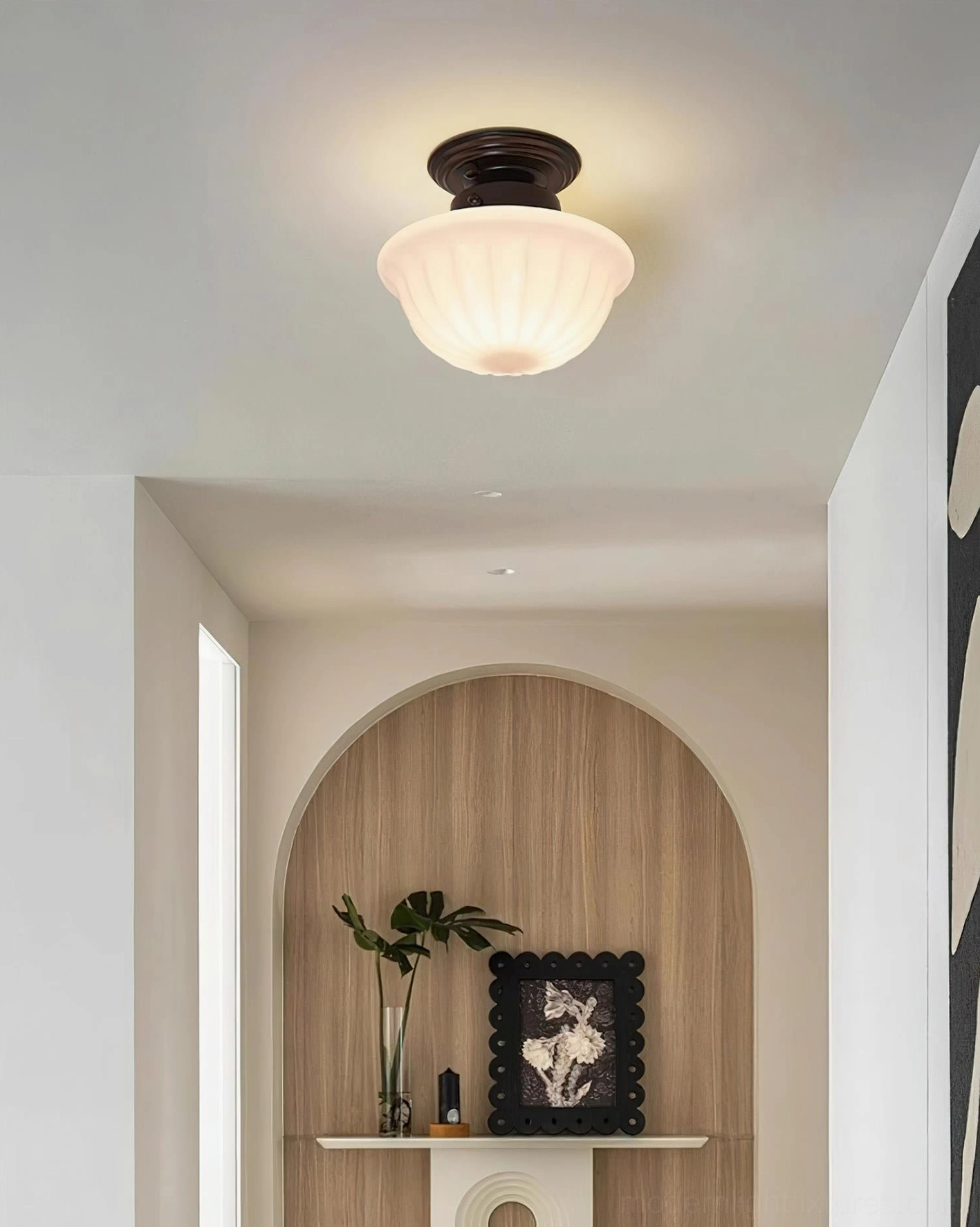 Ritten vintage ceiling light in minimalist hallway entryway creating warm ambient lighting