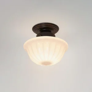 Close-up detail of Ritten ceiling light fixture showing textured ribbed glass shade and black metal canopy