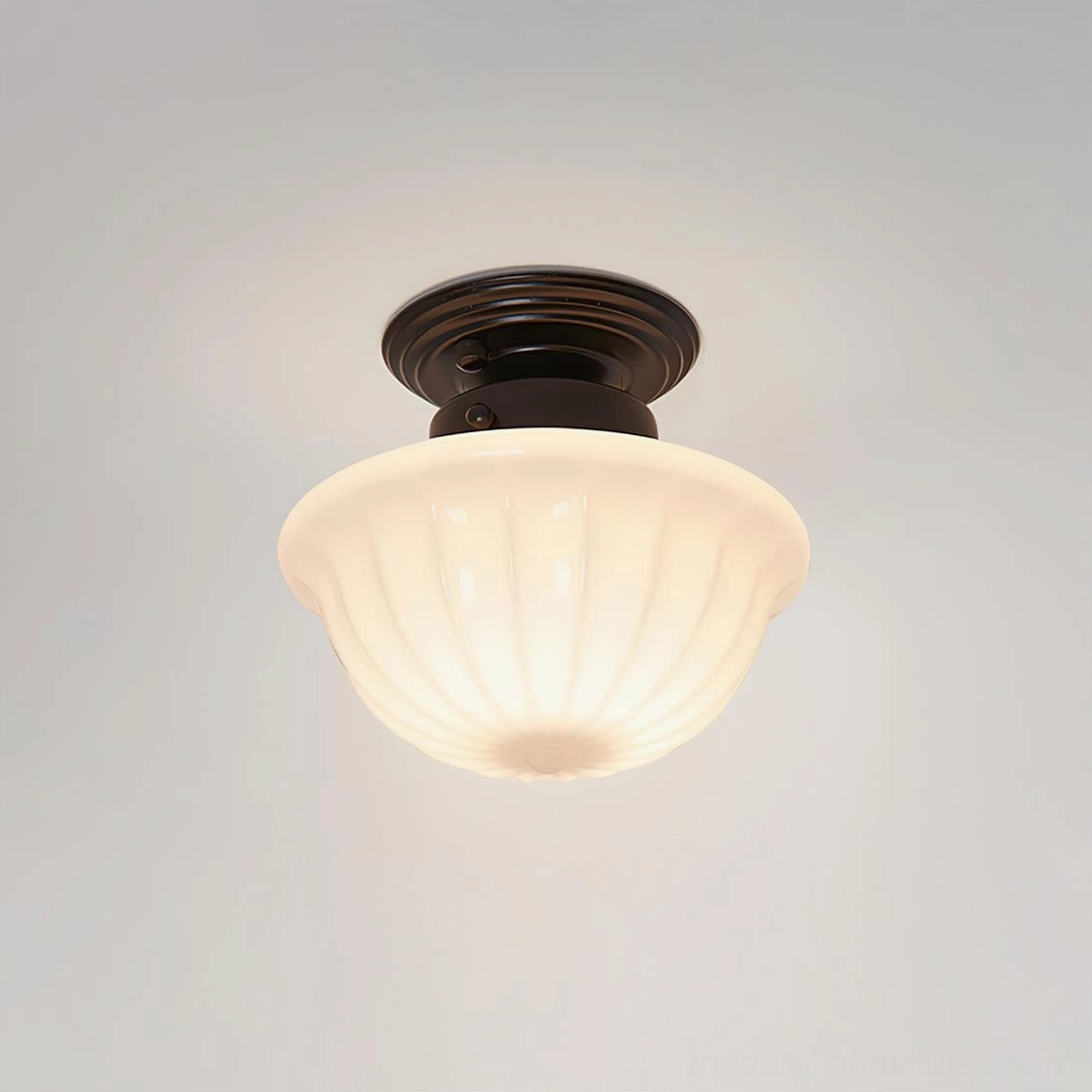 Close-up detail of Ritten ceiling light fixture showing textured ribbed glass shade and black metal canopy