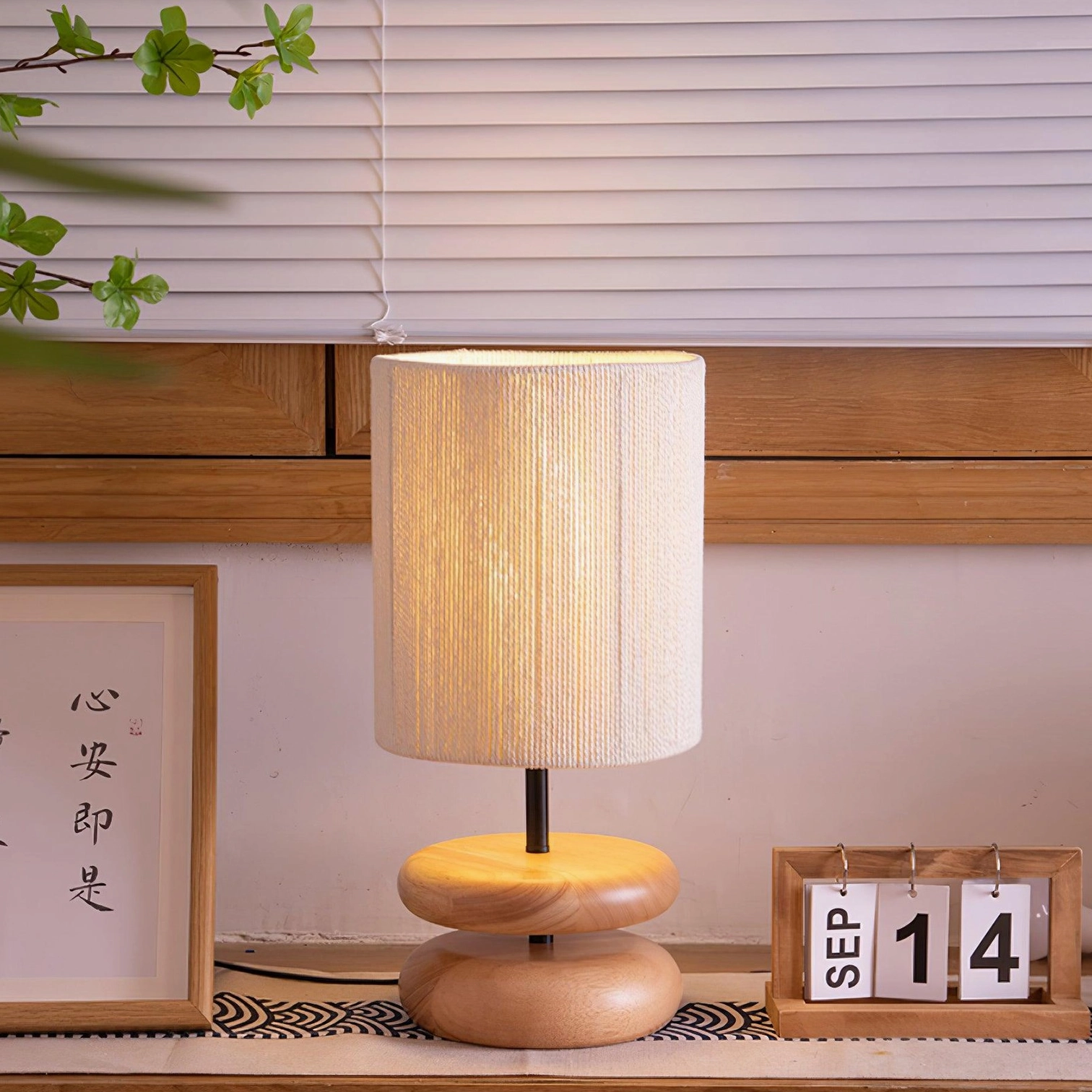 River rock inspired wooden lamp with dual stacked oval base design