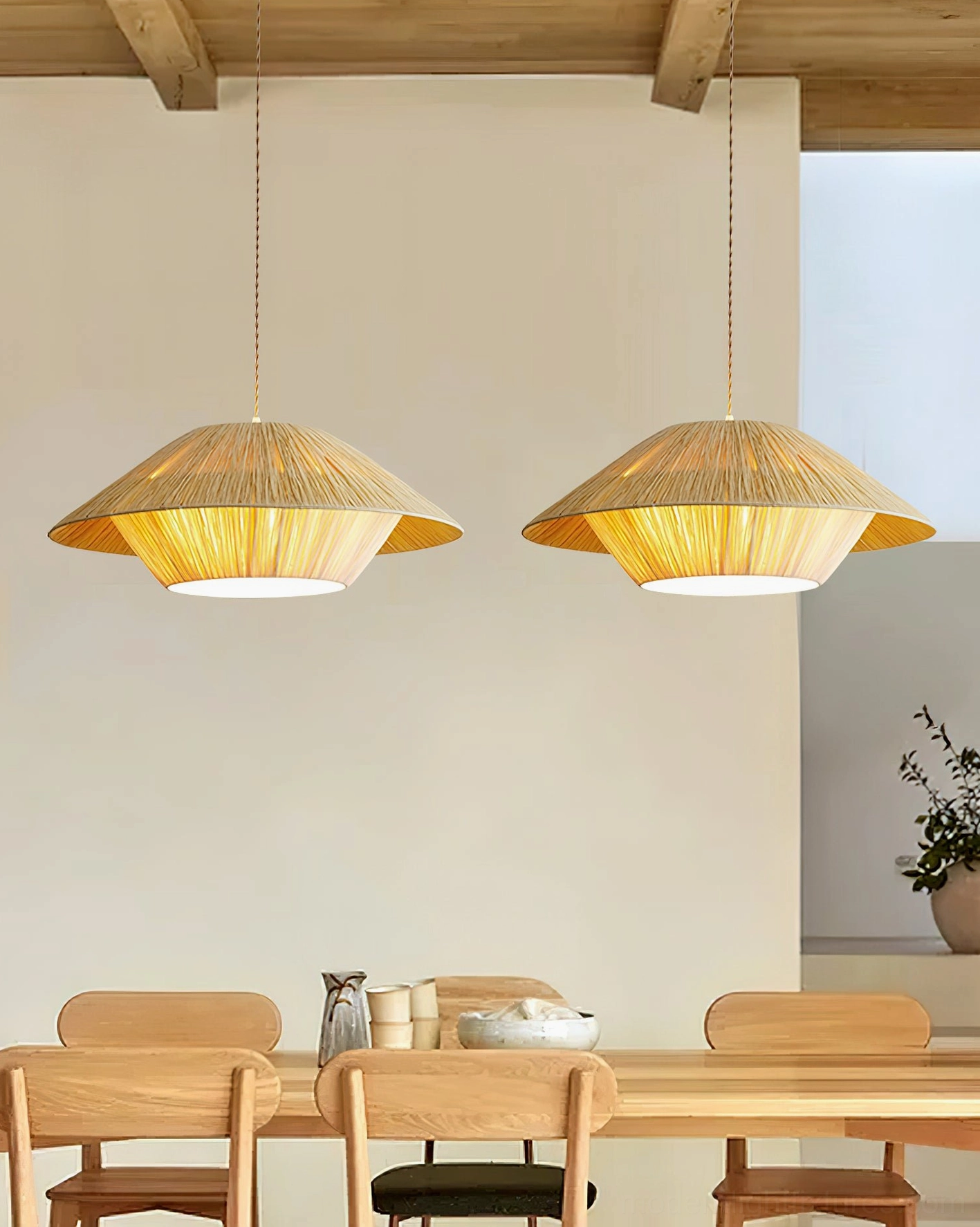 Close-up detail of Rivora pendant lamp showing fine natural raffia weave texture and craftsmanship