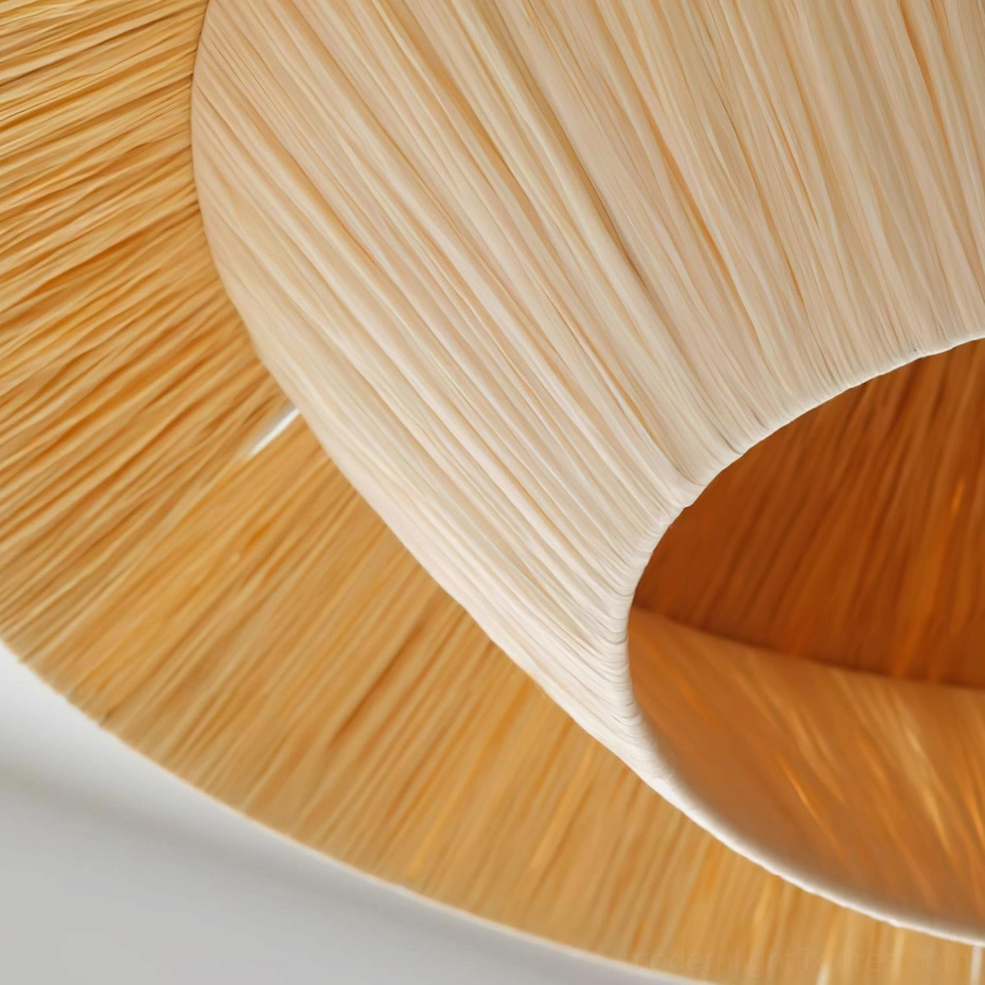 Full product lifestyle view of Rivora natural woven raffia pendant light in contemporary home interior