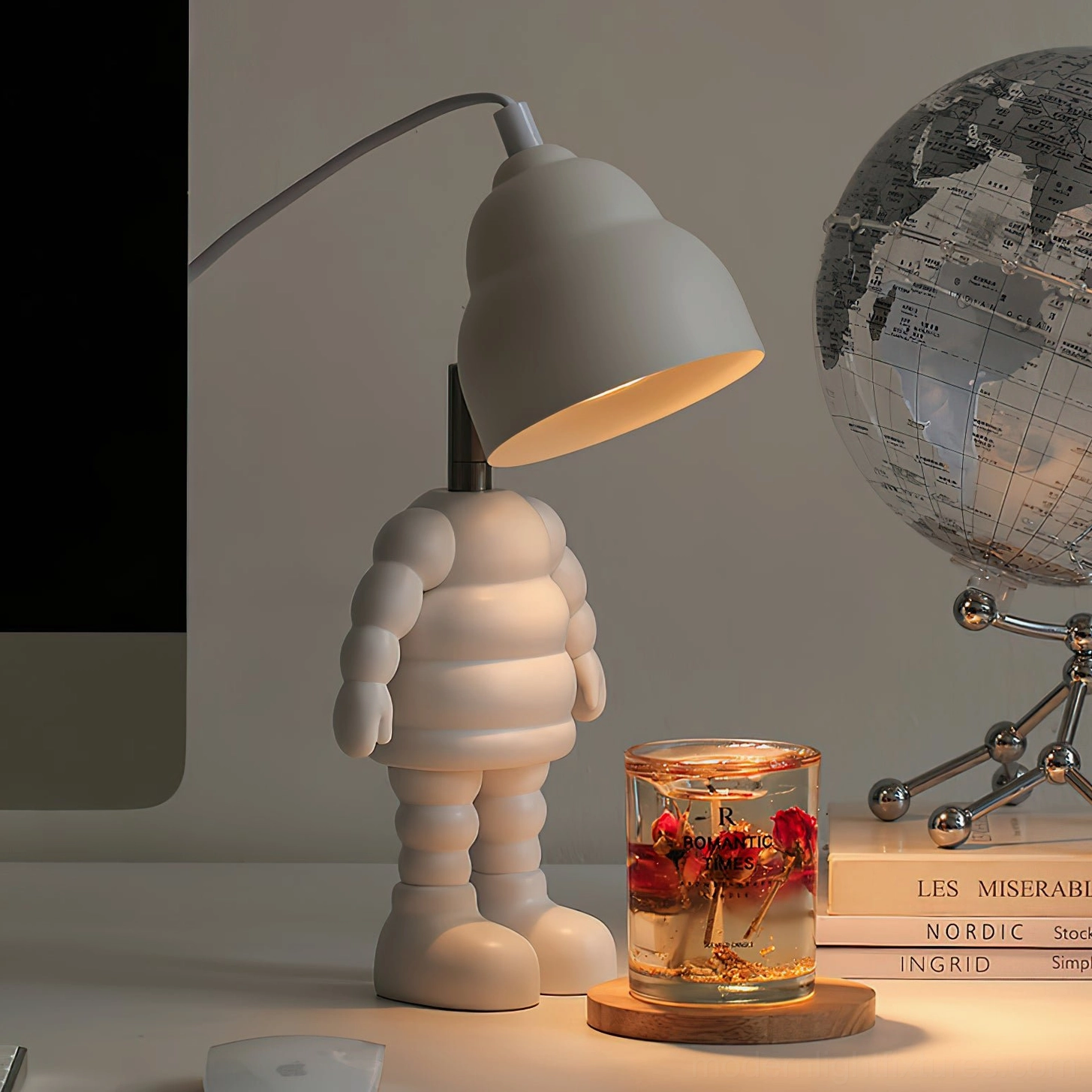 Robot-shaped candle warmer lamp demonstrating functional design with halogen bulb heat distribution capability