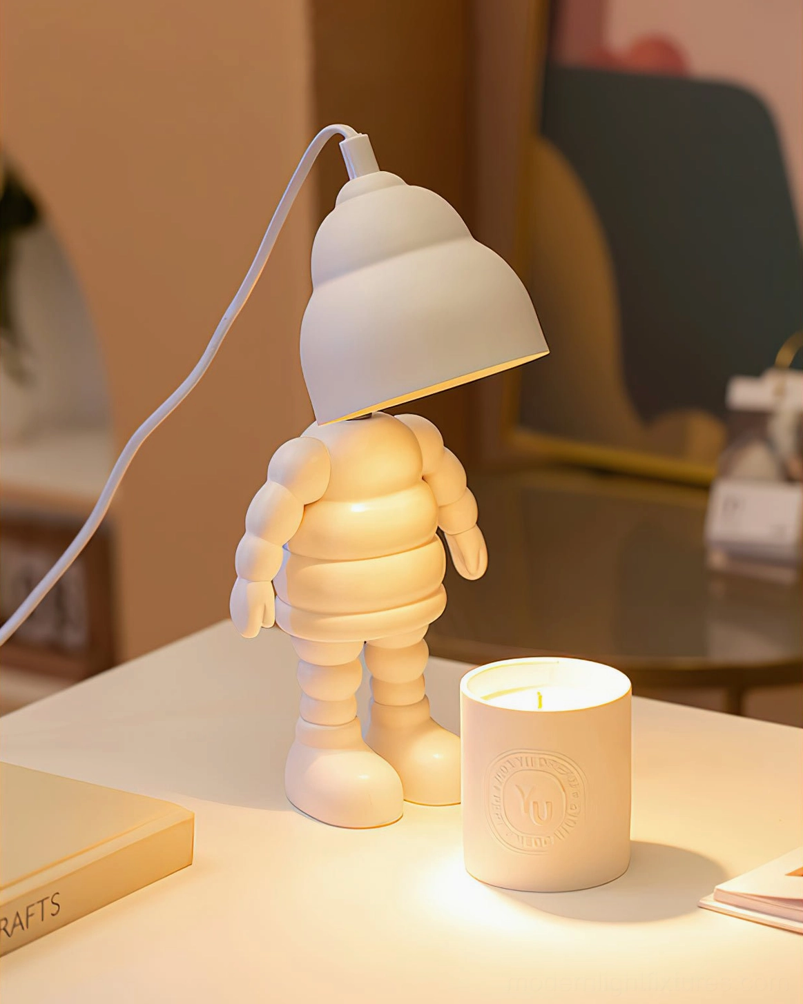 Robot candle warmer lamp as decorative table lamp accent in modern minimalist home interior setting
