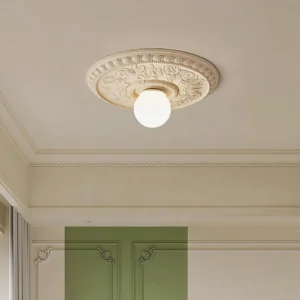 Rochelle flush mount ceiling light installed in classic living room with crown molding and traditional décor