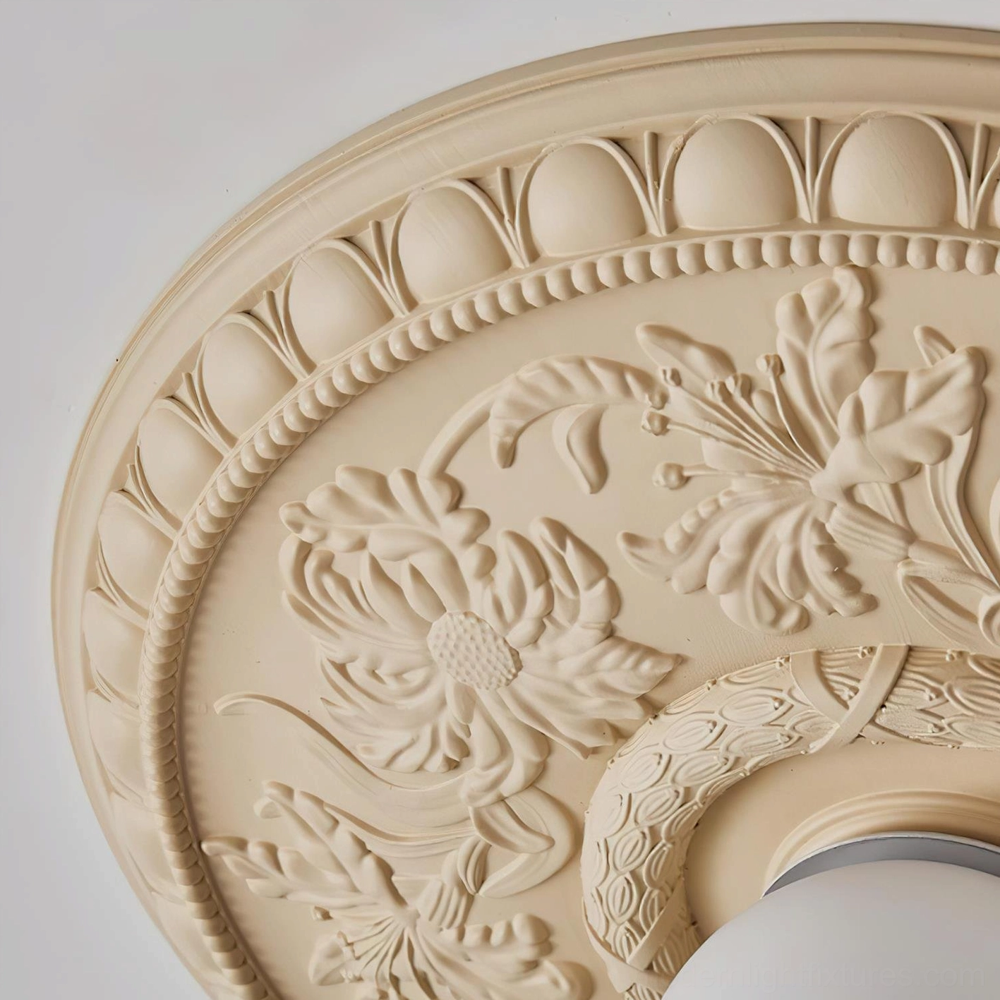 Close-up macro detail of Rochelle ceiling light base showing intricate floral carved relief and egg-and-dart trim