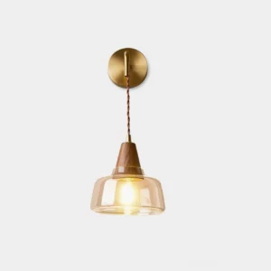 Rockford brass wall sconce with clear glass shade and twisted cord on white background, front view