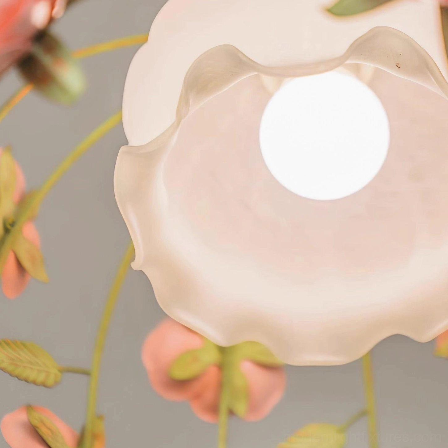 Romantic floral pendant light close-up detail of hand-carved pink roses with white frosted glass diffuser and green metal accents