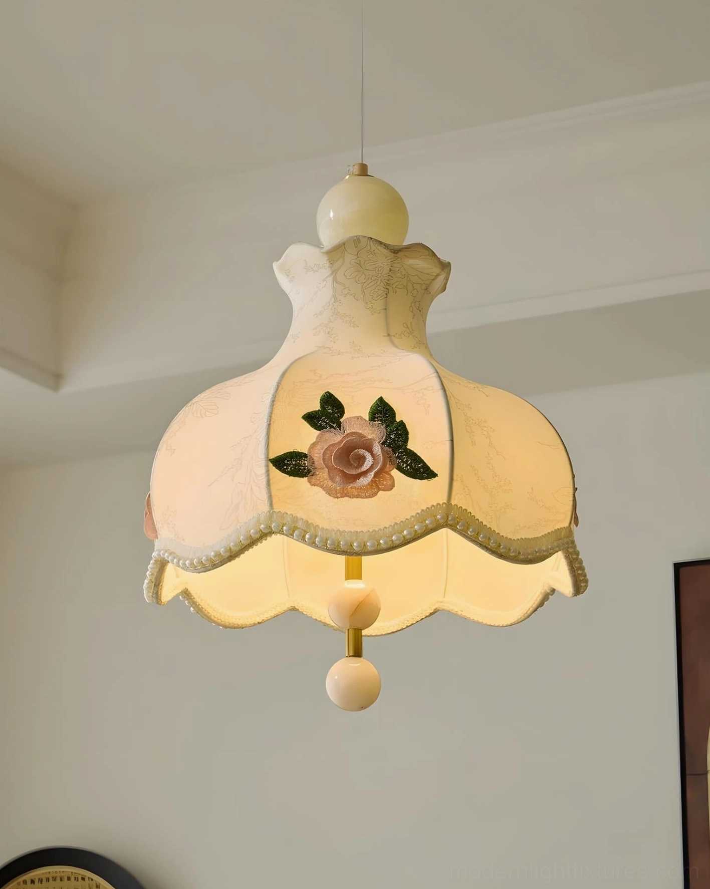 Romantic fabric pendant fixture showing scalloped beaded trim and layered embroidered floral design