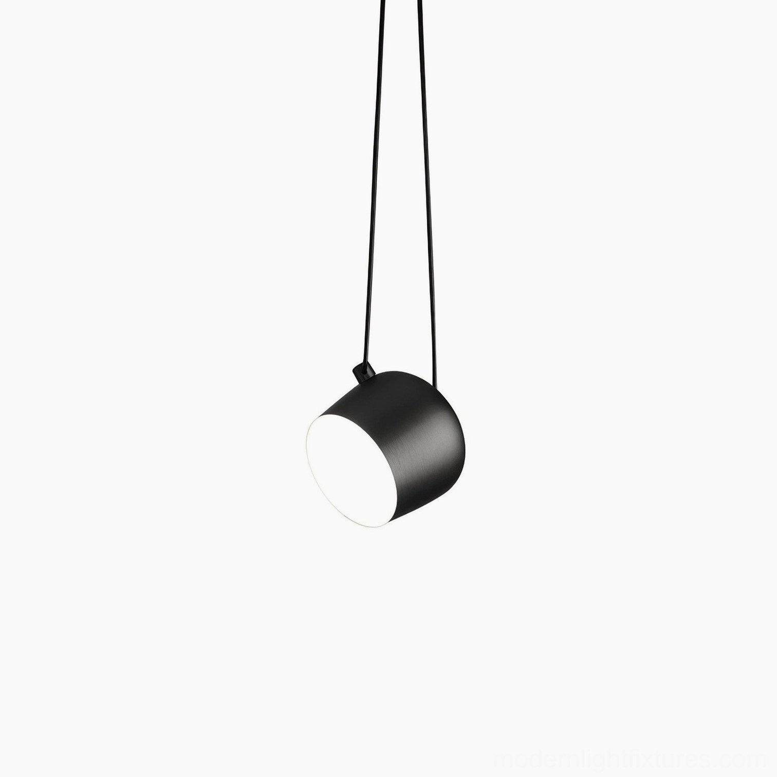 Ronan black cylindrical pendant lamp, matte metal minimalist design, studio silhouette view