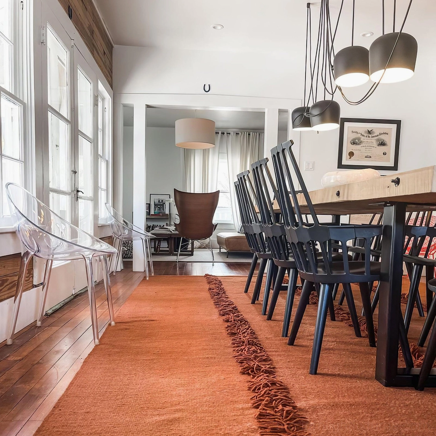 Ronan multi-head pendant fixture in warm modern dining room with wooden decor and cozy minimalist ambiance