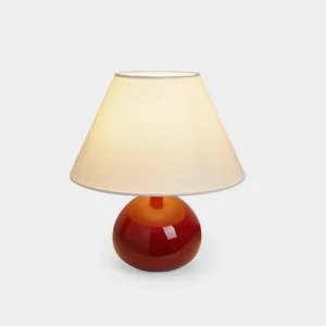 Ronda ceramic table lamp with rust orange glossy base and beige fabric shade, front view on white background