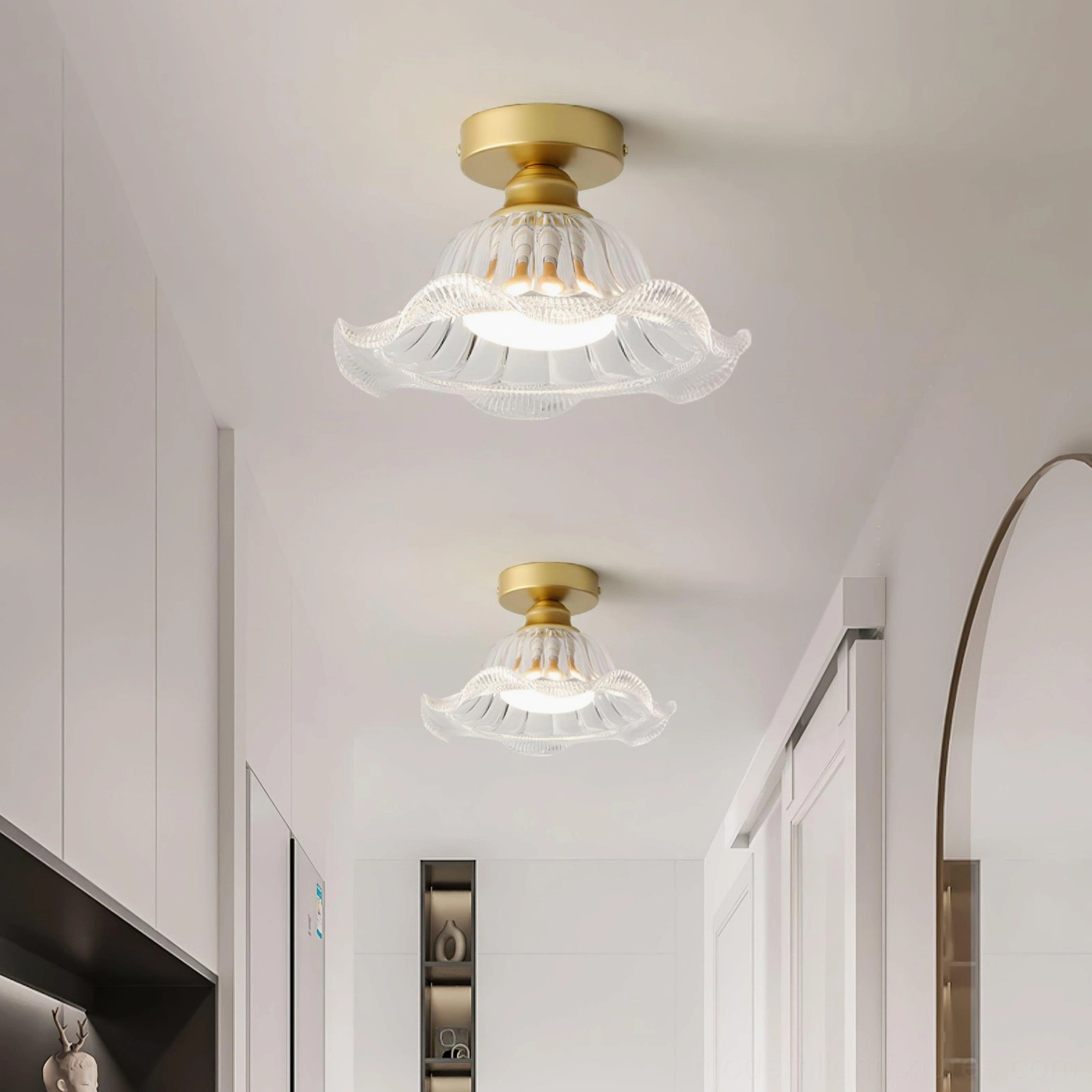 Rosa flush mount ceiling lights installed in modern white cabinet hallway with brass canopy details