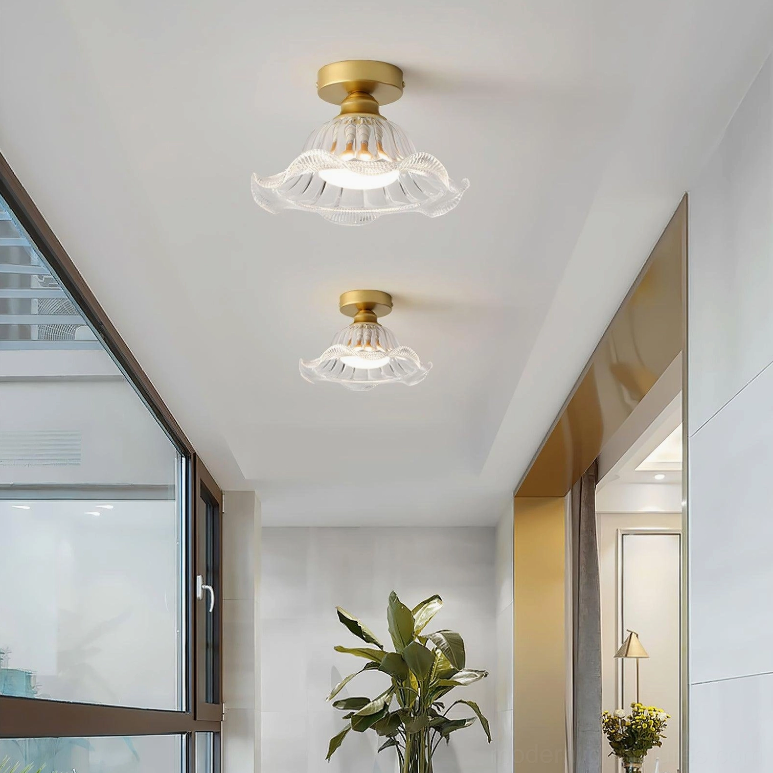 Pair of Rosa glass ceiling lights illuminating modern hallway corridor with natural window light