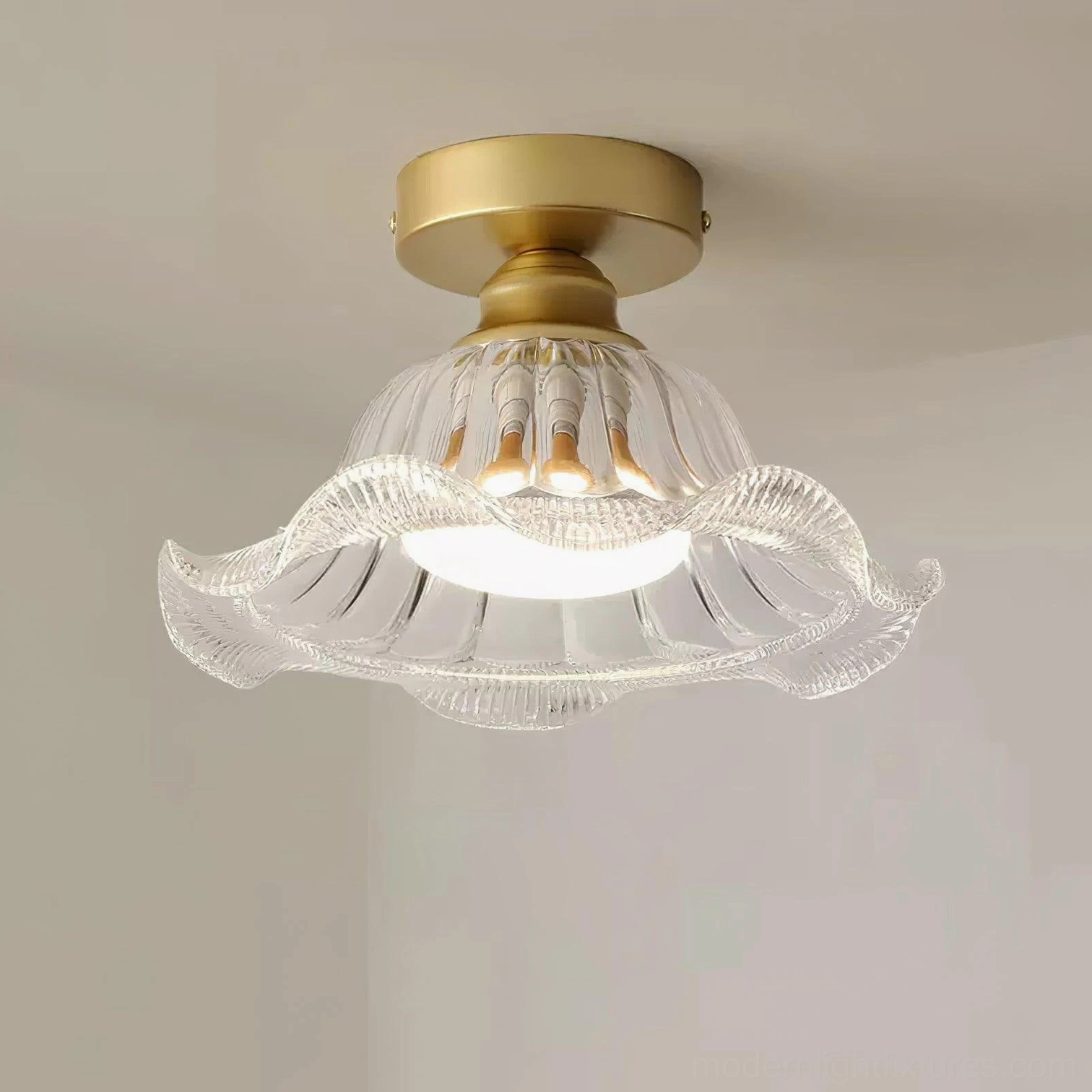 Rosa flower glass flush ceiling light mounted on warm white wall, interior lamp structure visible