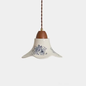 Rosalie blue ceramic pendant light with hand-painted floral motifs and walnut wooden fixture, front studio view
