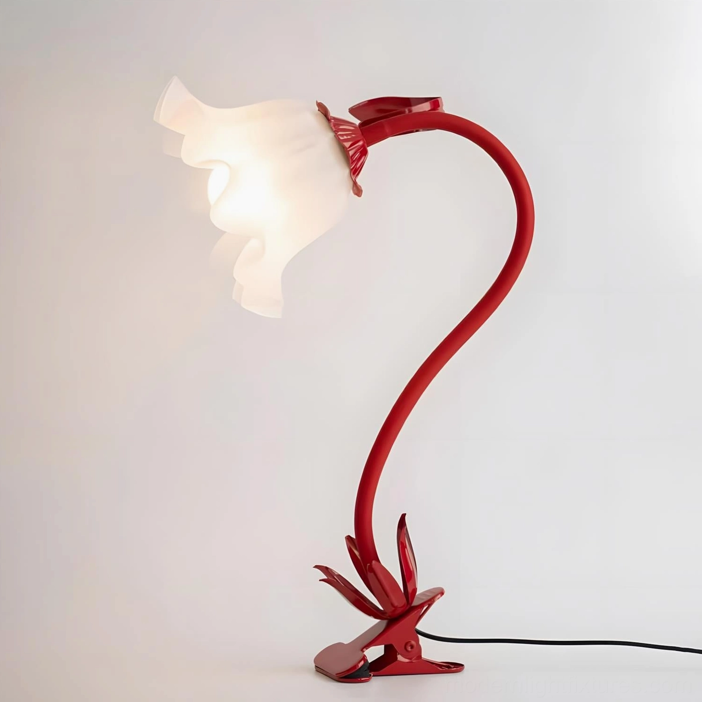 Rosalie table lamp in multiple colorways showing pink, purple, red white finish options on display shelf