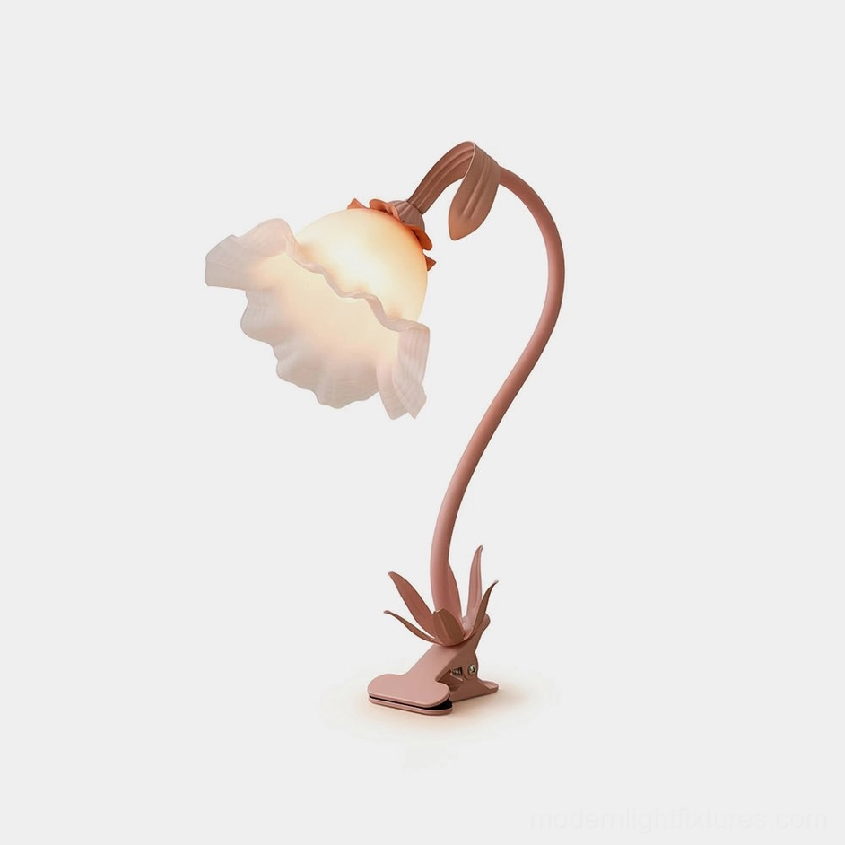 Rosalie floral table lamp with blush pink ruffled frosted glass shade and petal-inspired metal base on studio white background