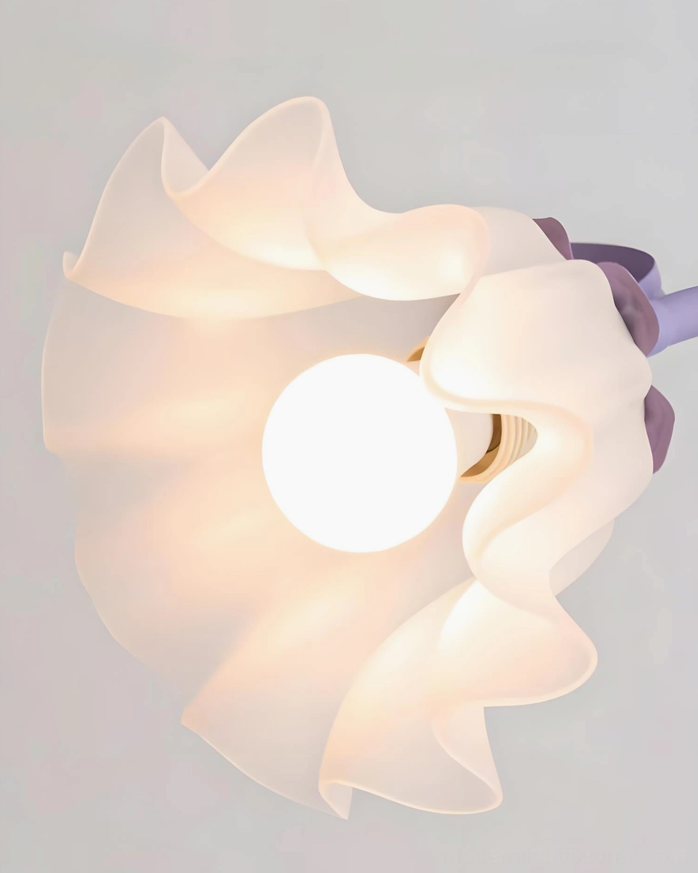 Crisp white Rosalie table lamp with botanical petal base on minimalist Scandinavian interior background