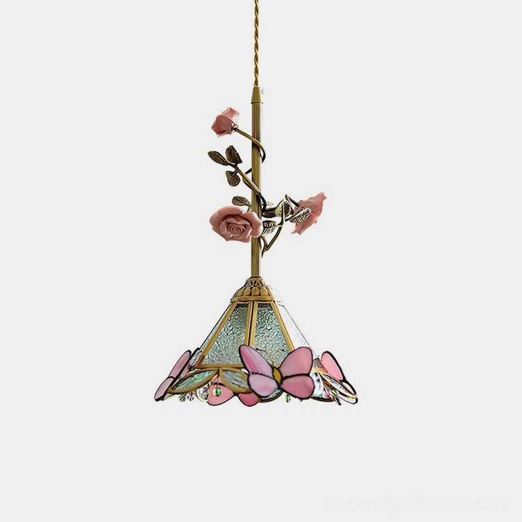 Rosavine floral pendant light with hand-sculpted pink roses and stained glass shade in vintage brass finish, front studio view